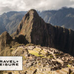 Photo of Machu Picchu in Peru with the Travel + Leisure logo overlayed in the lower left corner