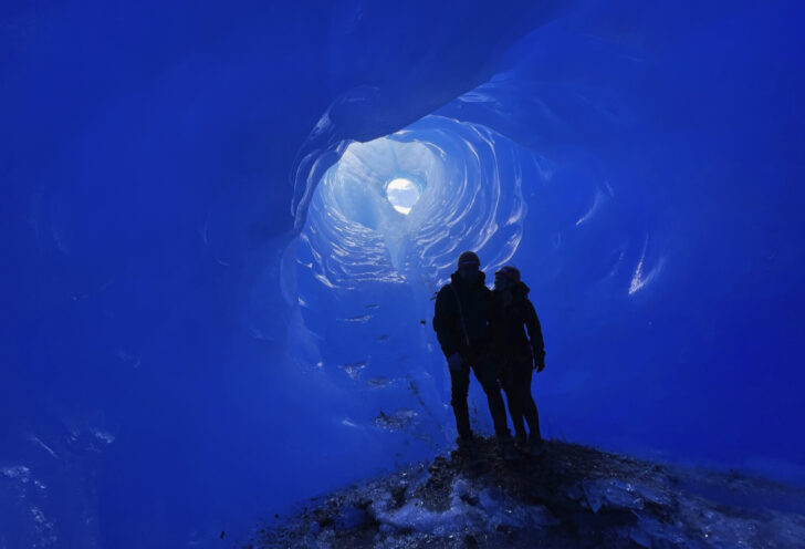 Winners pose for picture inside ice cave in Argentina