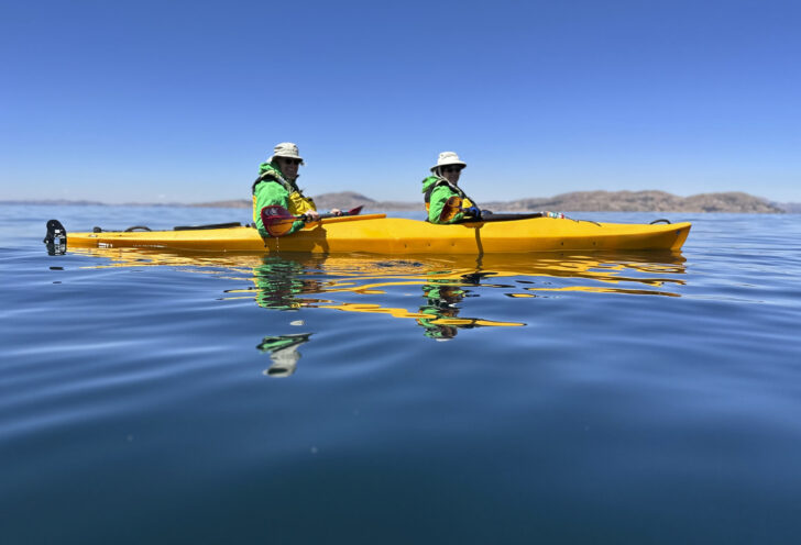 Knowmad Travelers kayak on pristine Lake Titicaca in Peru