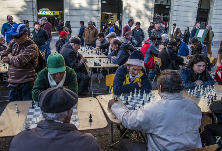 Santiago, Chile in 48 Hours in Plaza de Armas. Locals play chess at outdoor tables