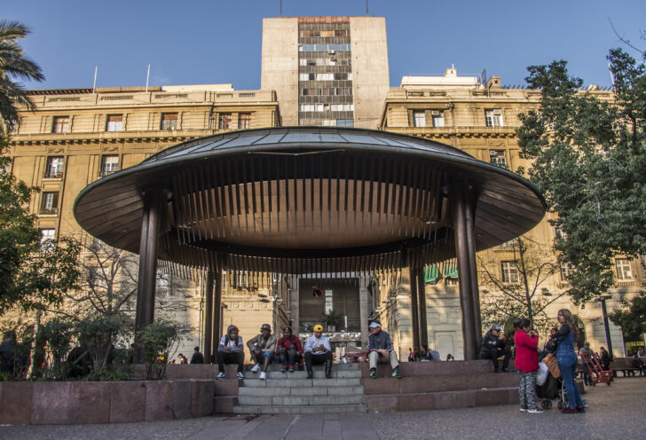 Locals sit under a gazebo at the Plaza de Armas in Santiago, Chile.