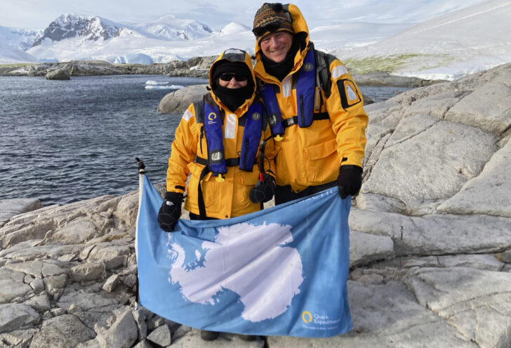 Antarctica expedition travelers pose in their gear.