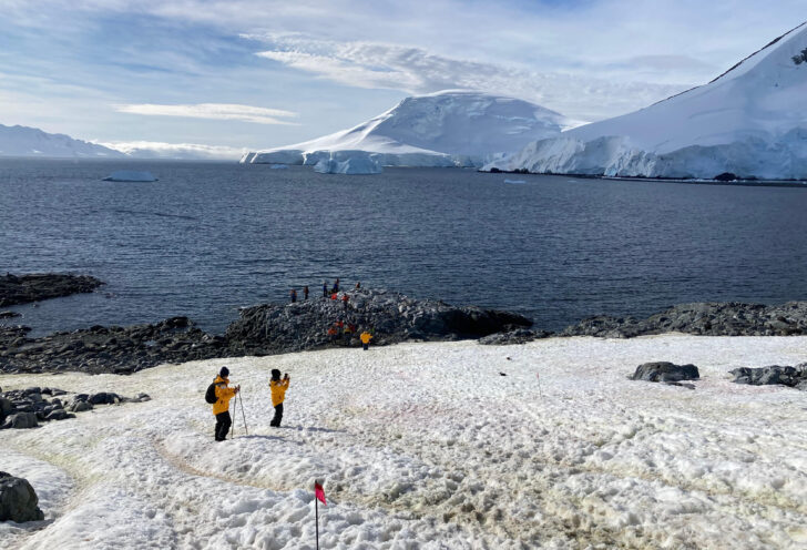 Knowmad travelers snap photos during their Antarctica expedition cruise.