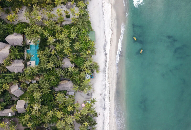 Pristine beach in Tayrona National Natural Park, Colombia with white sand and clear blue water.